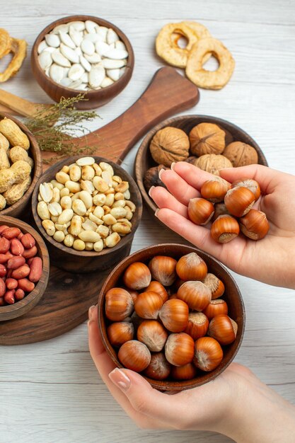 Top view different fresh nuts peanuts hazelnuts and walnuts