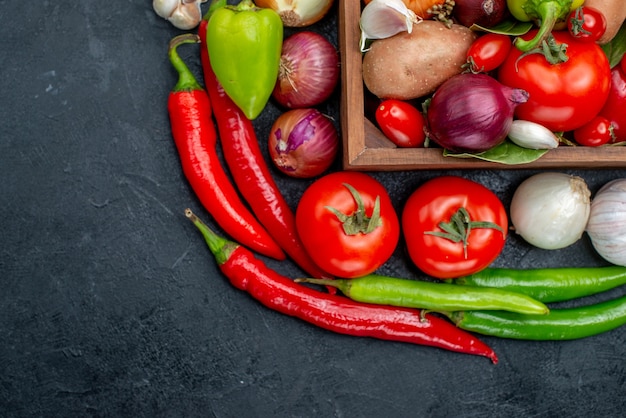 Top view different fresh vegetables on dark table fresh ripe color salad