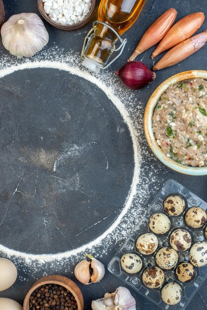 Top view different seasonings with greens and eggs on gray background meat raw color food pie flour dough eggs tasty