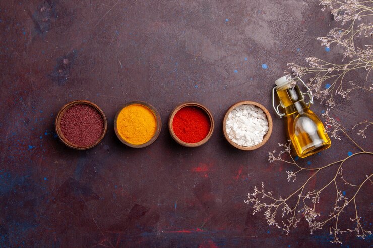 Free Photo top view different seasonings with olive oil on dark space