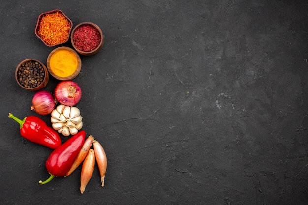 Top view different seasonings with vegetables on dark background ripe meal vegetable salad