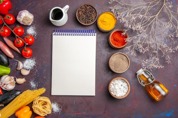 Free photo top view different seasonings with vegetables on a dark background spicy pepper meal salad health