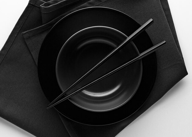 Top view of dinnerware with chopsticks