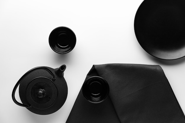 Top view of dinnerware with teapot