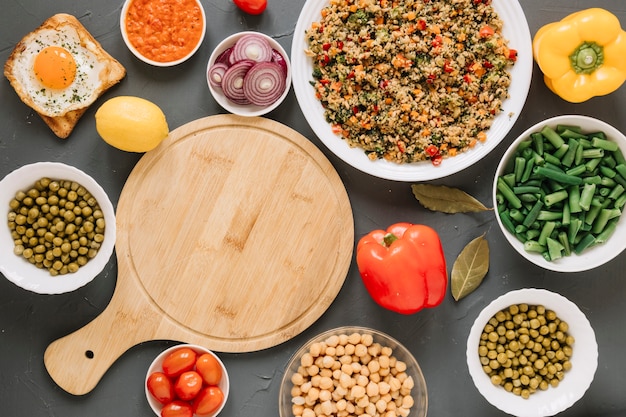 Top view of dishes with cherry tomatoes and lemon