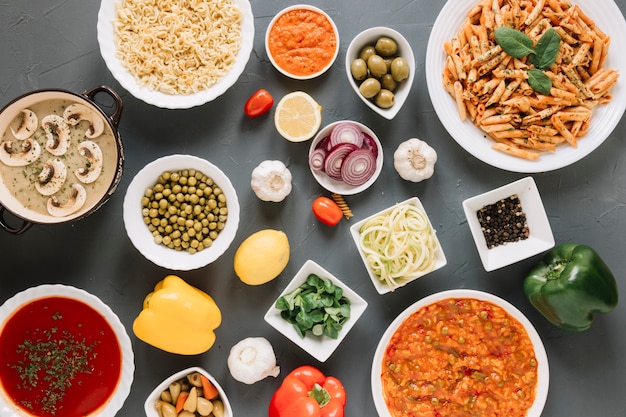 Top view of dishes with garlic and pasta