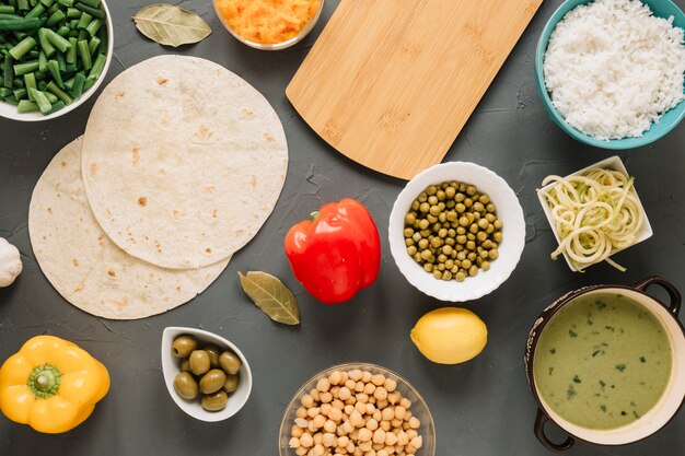 Top view of dishes with green beans and lemon