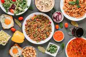 Free photo top view of dishes with pasta and glass of wine