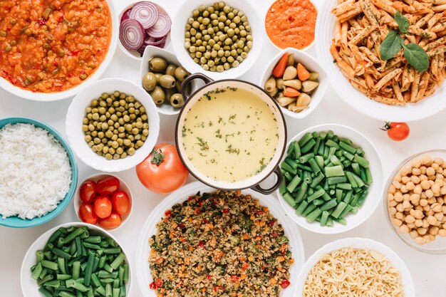 Top view of dishes with pasta and green beans