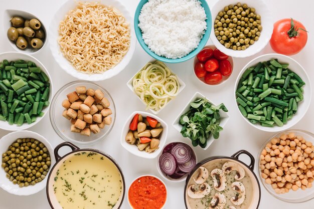 Top view of dishes with rice and mushroom soup