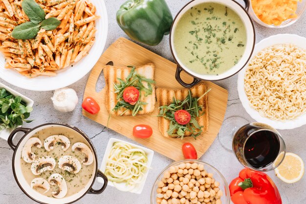 Top view of dishes with toast and cherry tomatoes