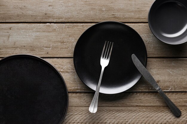 Top view of dishware with fork and knife