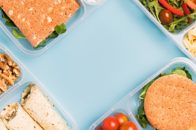 Free photo top view diverse lunchboxes with copy-space