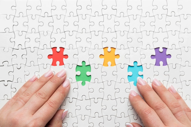 Free photo top view diversity arrangement with different pieces of puzzle