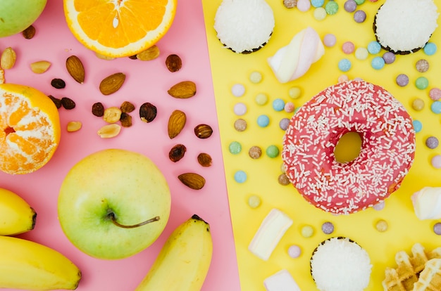 Free photo top view donut vs fruit