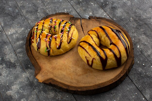 top view donuts with chocolate on the grey floor