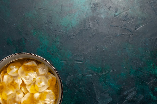 Top view dough soup with minced meat inside dough on dark-blue desk ingredients soup food meal dough dish dinner sauce