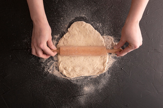 Free photo top view dough on stucco background