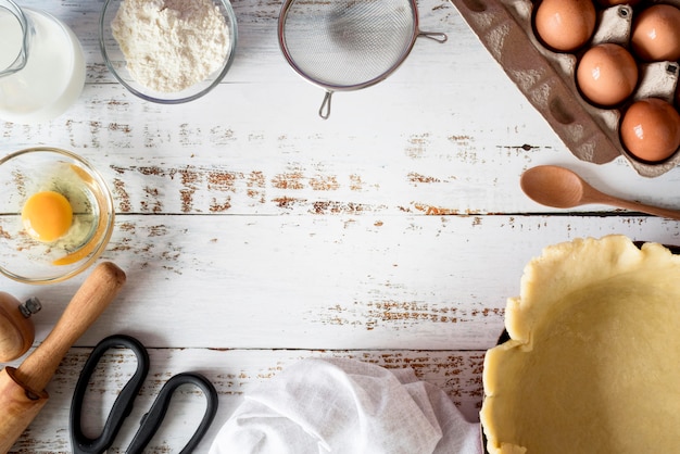 Top view dough in tray with eggs