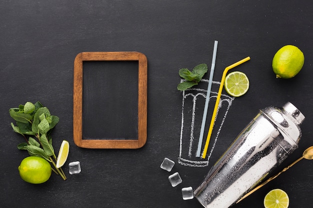 Top view of drawn cocktail glass with straws and blackboard