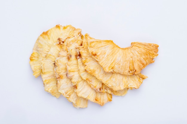 Free photo top view of dried pineapple slices isolated on white background