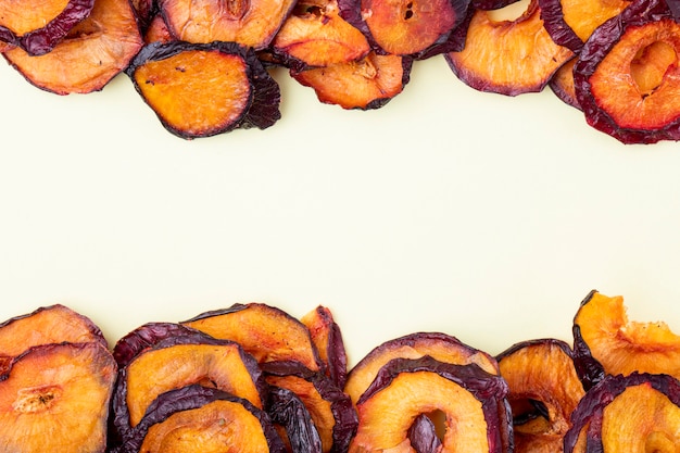 Top view of dried plum slices isolated on a white background with copy space