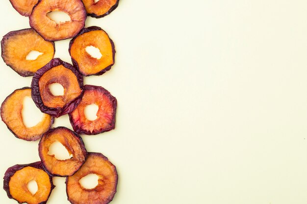 Top view of dried plum slices isolated on a white background with copy space