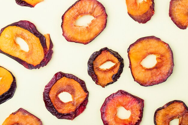 Top view of dried plum slices isolated on a white background