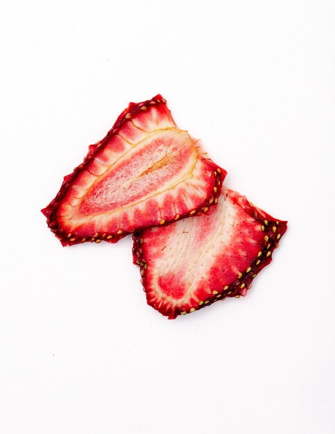 Top view of dried strawberry slices isolated on white background