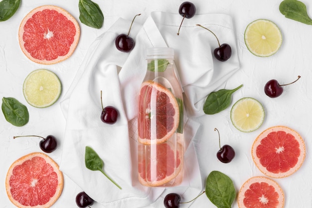 Top view drink and cherries arrangement