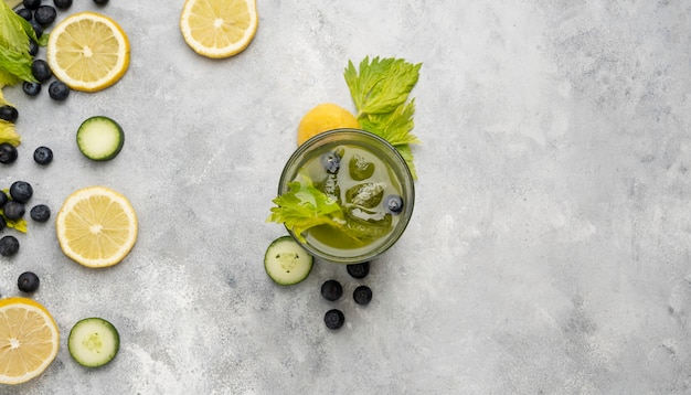 Top view drink with herbs and fruits