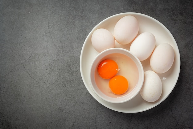 Top view of duck eggs on dark surface