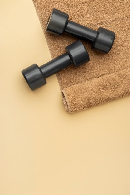 Top view dumbbells on towel