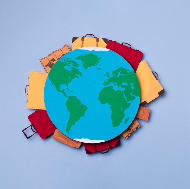 Top view earth surrounded by luggage concept