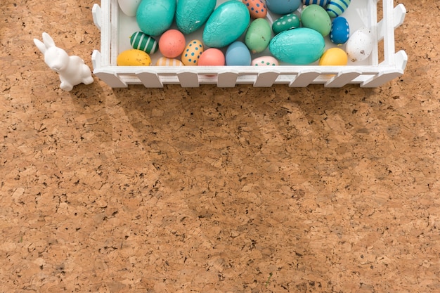 Free photo top view of easter composition on cork background