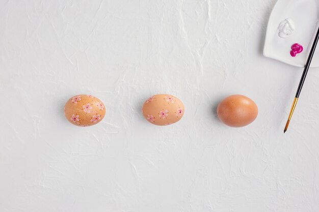 Top view of easter eggs with paint
