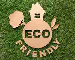 Free photo top view eco friendly sign on grass