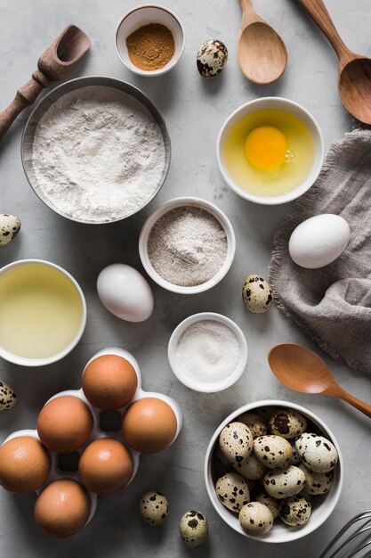 Top view egg collection and ingredients beside