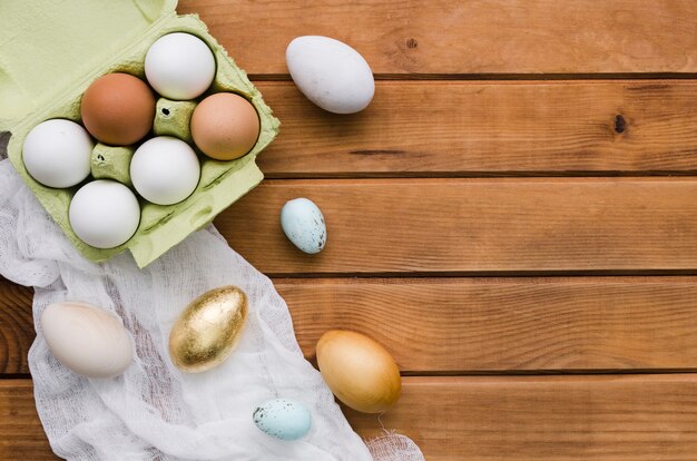 Top view of eggs in carton with copy space for easter