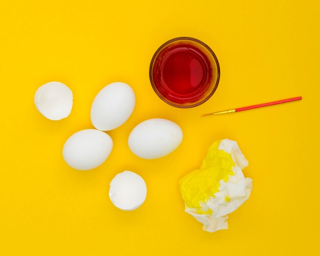 Top view of eggs for easter with paint on napkin