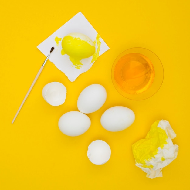 Top view of eggs for easter with yellow paint