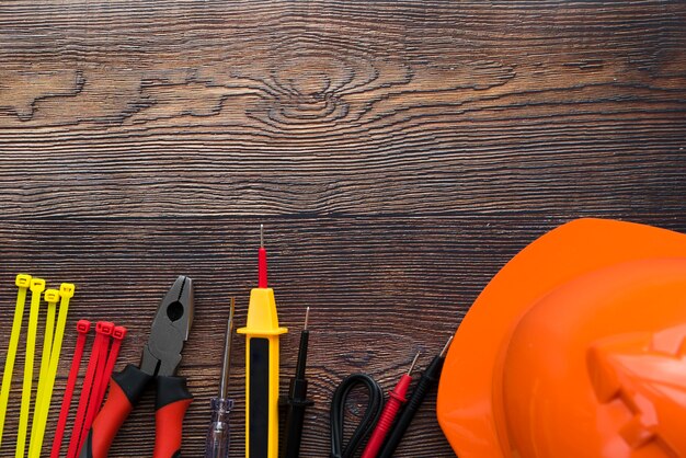 Top view of electric equipment on wooden background