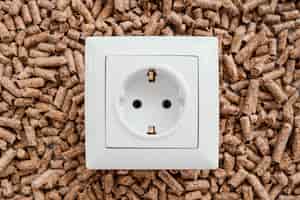 Free photo top view of electric socket on pellets