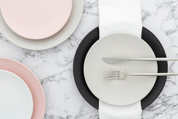 Top view elegant cutlery and plates