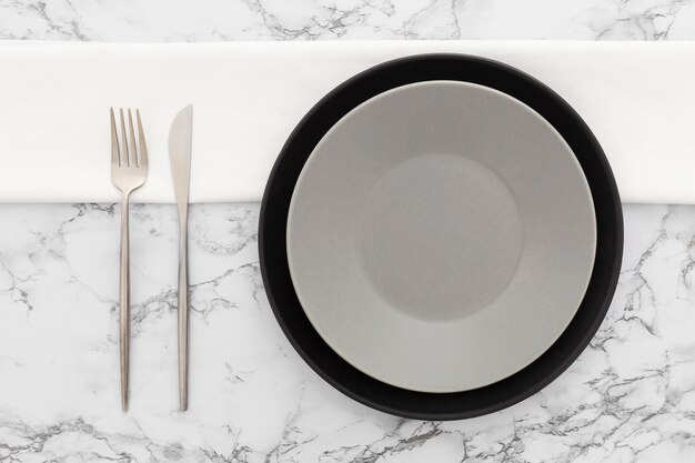 Top view elegant plate with cutlery