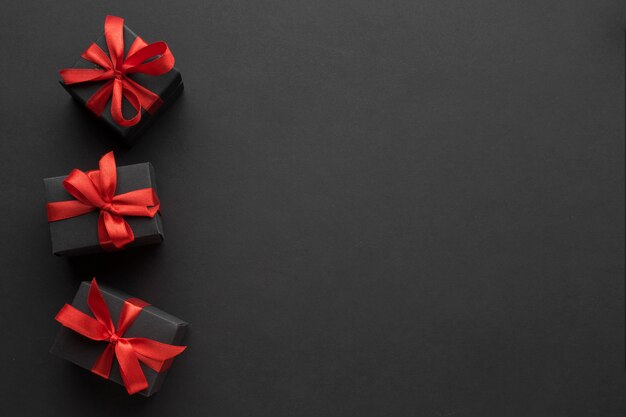 Top view of elegant presents with red ribbon