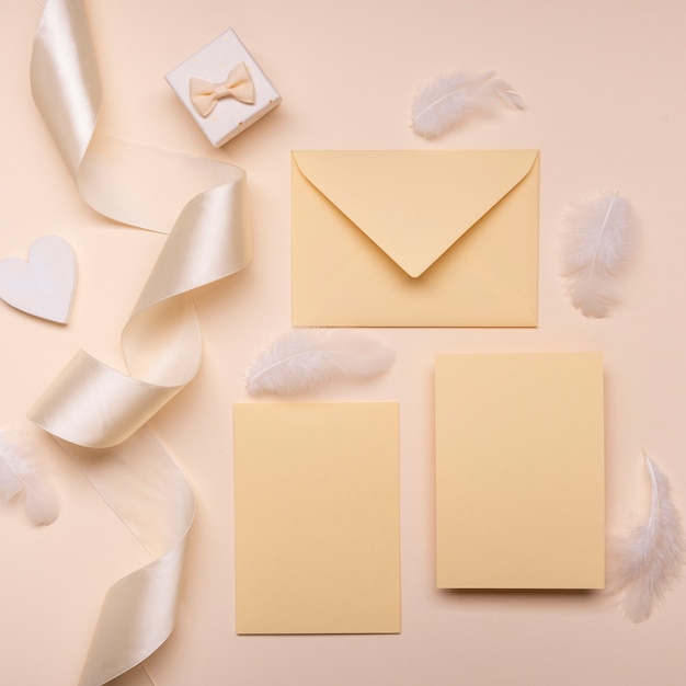 Top view elegant wedding envelopes with ribbon