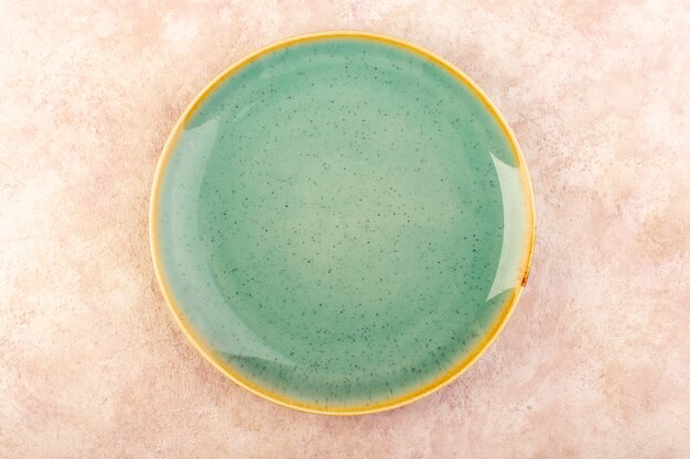 A top view empty green plate round shaped isolated meal table