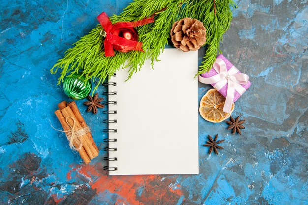top view empty open notepad with green branch