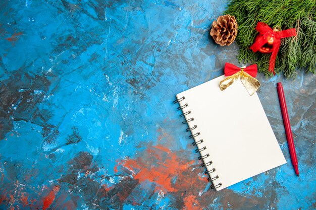 top view empty open notepad with red pencil